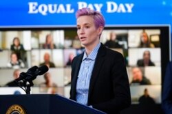 United States Soccer Women's National Team member Megan Rapinoe speaks during an event to mark Equal Pay Day in the South Court Auditorium in the Eisenhower Executive Office Building on the White House Campus, March 24, 2021.