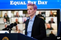 United States Soccer Women's National Team member Megan Rapinoe speaks during an event to mark Equal Pay Day in the South Court Auditorium in the Eisenhower Executive Office Building on the White House Campus, March 24, 2021.