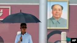 Portrait de Mao Zedong sur la place Tienanmen a Pekin en 2015 (AP Photo/Ng Han Guan)