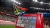 South Africa&#39;s Ntando Mahlangu celebrates after winning the men&#39;s long jump - T63 final of the Tokyo 2020 Paralympic Games at the Olympic Stadium in Tokyo on August 28, 2021. Philip FONG / AFP