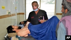 Injured men receive treatment at a hospital in Quetta, Pakistan, Oct. 11, 2024, following an attack by gunmen in Balochistan province the day before. 