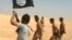 An image grab taken from a video uploaded on social networks on Aug. 28, 2014, shows young men in underwear being marched barefoot along a desert road before being allegedly executed on Aug. 27, 2014 by Islamic State (IS) militants at an undisclosed location in Syria's Raqa Province.