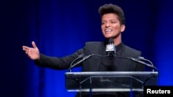 Singer Bruno Mars speaks at the Super Bowl half time press conference in New York, Jan. 30, 2014. 