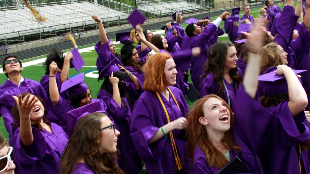 Graduates throw their mortarboards into the air in celebration after receiving their diplomas, following the commencement ceremony at Boulder High School, in Boulder, Colo. on Saturday May 18, 2013. (AP Photo/Brennan Linsley)