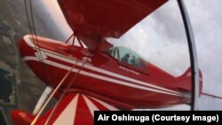 Oshinuga in his aerobatic airplane