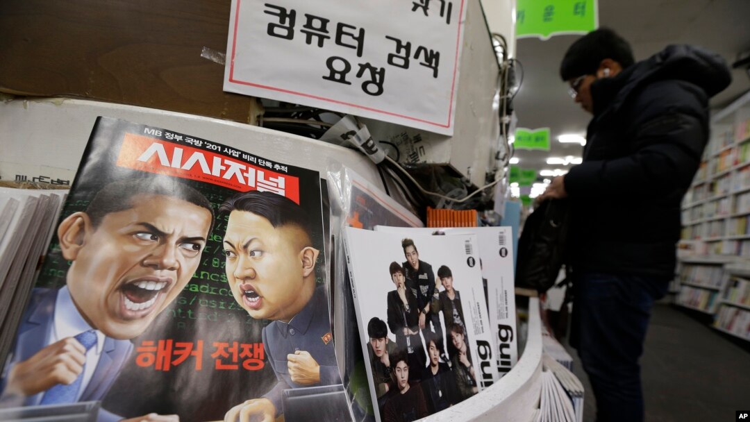 Ảnh biếm hoạ của Tổng thống Mỹ Barack Obama và lãnh tụ Bắc Triều Tiên Kim Jong Un tại một cửa hàng sách ở Seoul, Hàn Quốc. 