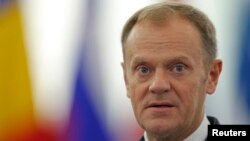 FILE - European Council President Donald Tusk addresses the European Parliament during a debate in Strasbourg, France, Oct. 27, 2015. 