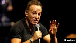FILE - Singer Bruce Springsteen talks to journalists after a sound check session ahead of his concert in Cape Town, South Africa, Jan. 26, 2014. 