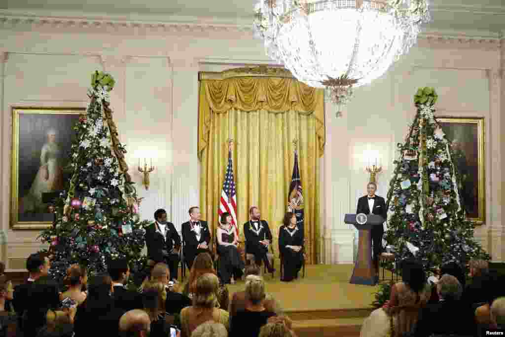 U.S. President Barack Obama delivers remarks at a reception for 2014 Kennedy Center honorees, from left, Al Green, Tom Hanks, Patricia McBride, Sting and Lily Tomlin at the White House, Dec. 7, 2014.