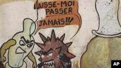 Graffitis sur un mur à Yaoundé, au Cameroun, expliquant comment un préservatif peut protéger les personnes contre le VIH/sida.