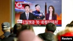 FILE - People watch a TV news report on North Korea, in Seoul, South Korea, Nov. 29, 2017.