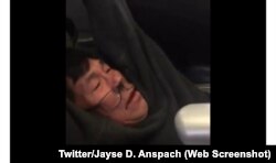 David Dao, a United Airlines passenger, is shown getting dragged off the plane by police in this video from Twitter.