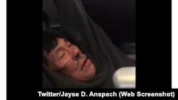 David Dao, a United Airlines passenger, is shown getting dragged off the plane by police in this video from Twitter.