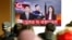 FILE - People watch a TV news report on North Korea, in Seoul, South Korea, Nov. 29, 2017.