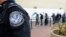 Pedestrians crossing from Mexico into the United States at the Otay Mesa Port of Entry wait in line, Dec. 10, 2015, in San Diego. U.S. Customs and Border Protection is now capturing biometric facial and eye scans of foreigners entering the country at San 