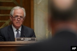 Chairman Sen. Bob Corker, R-Tenn., left, listens during a Senate Foreign Relations Committee hearing on North Korea on Capitol Hill in Washington, Nov. 14, 2017.