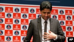 FILE - Paris Saint-Germain soccer club President Nasser Al-Khelaifi arrives to speak to the media during a press conference at Parc des Princes stadium in Paris, France, May 17, 2013.