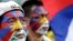 Activists with the colors of the Tibetan flag painted on their faces are seen at a rally in Taipei March 10, 2013.