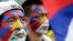 Activists with the colors of the Tibetan flag painted on their faces are seen at a rally in Taipei March 10, 2013.