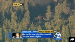 Image taken from video provided by KABC-TV, the cabin in Big Bear, Calif. where ex-Los Angeles police officer Christopher Dorner is believed to be barricaded inside is in flames Tuesday, Feb. 12, 2013.