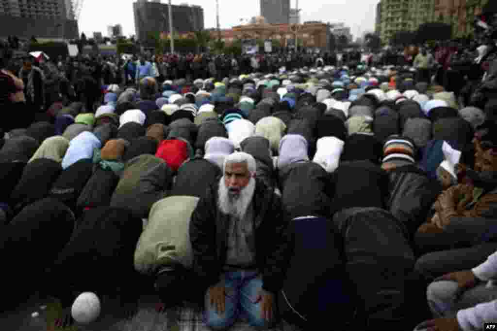 Anti-government protesters pray in Tahrir, or Liberation Square in Cairo, Egypt, Tuesday, Feb. 1, 2011. More than a quarter-million people flooded into the heart of Cairo Tuesday, filling the city's main square in by far the largest demonstration in a wee