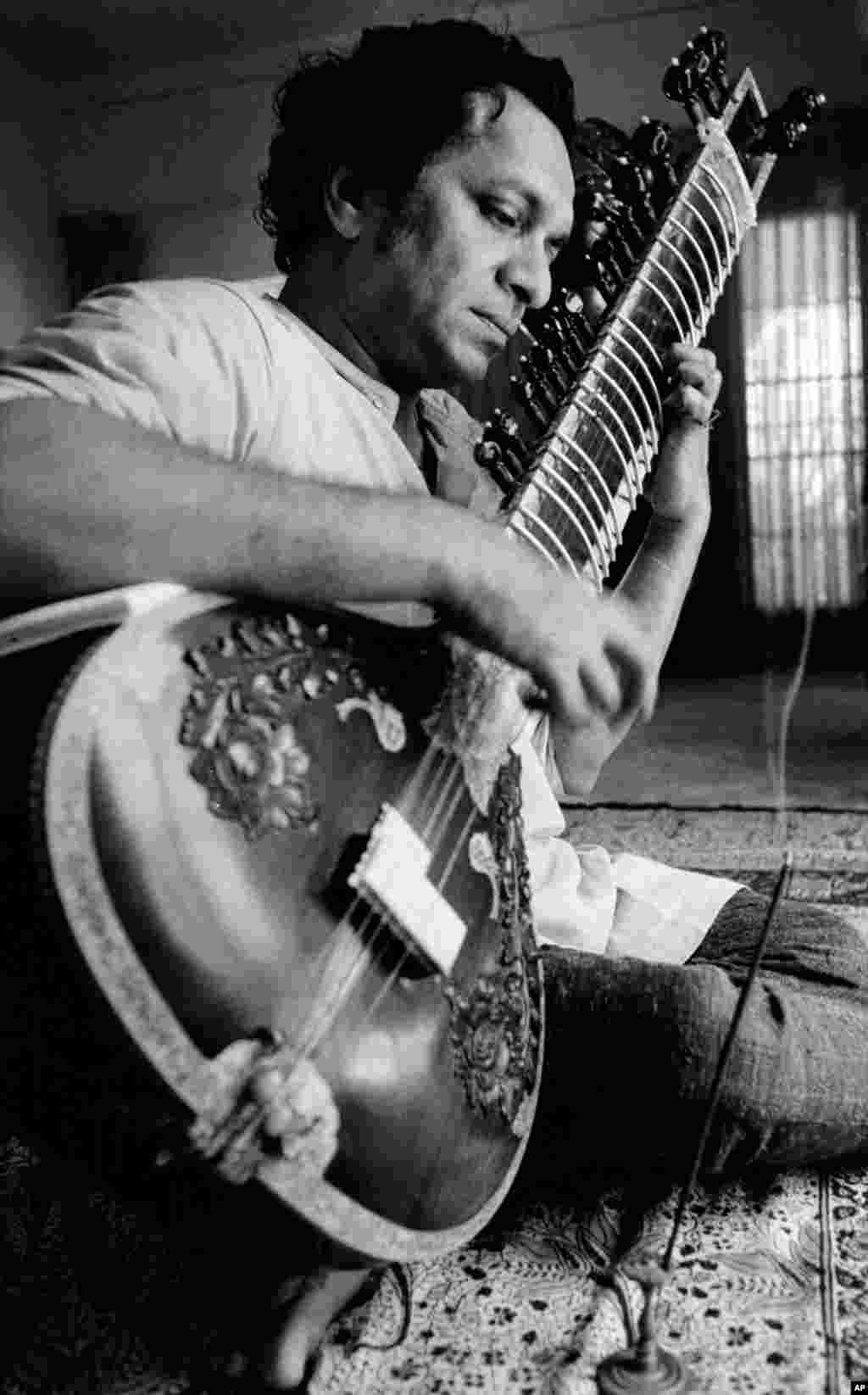 In this 1967 file photo, Ravi Shankar plays his sitar in Los Angeles, California.