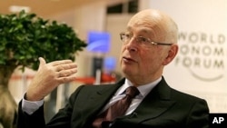 World Economic Forum founder Klaus Schwab speaks with the press inside the Congress Center at Davos, Switzerland (2010 file photo)