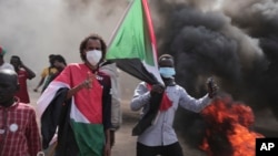 People protests against the October military coup in Khartoum, Sudan, Dec. 19, 2021. Monitors have received reports of security members using disproportionate force against protesters, with some reports accusing them of sexually assaulting demonstrators.