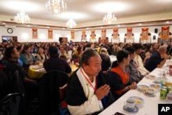 Hundreds attend the 18th birthday and enthronement ceremony for U.S.-born Buddhist lama, Jalue Dorje, at the Tibetan American Foundation of Minnesota in Isanti, Minnesota, Nov. 9, 2024.