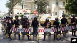 Security forces and tanks stand outside the now vacated Saudi embassy in Cairo, April 29 2012.