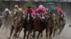 Luis Saez riding Maximum Security, second from right, goes around turn four with Flavien Prat riding Country House, left, Tyler Gaffalione riding War of Will and John Velazquez riding Code of Honor, right, during the 145th running of the Kentucky Derby ho