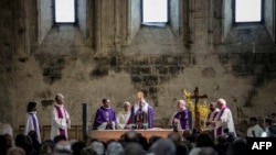 Priests celebrate a religious ceremony for victims of a Germanwings flight that crashed in the French Alps, killing all 150 aboard, on March 28, 2015 at Notre-Dame-du-bourg cathedral in Digne-les-Bains, near the site of the crash.