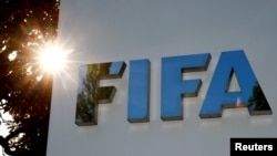 FILE - The logo of FIFA is seen in front of its headquarters in Zurich, Switzerland, Sept. 26, 2017.