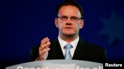 FILE - Australian opposition Labor leader Mark Latham makes a concession speech to the Labor party's election evening rally in Sydney, Oct. 9, 2004..