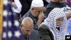 An American flag adorns the stage as worshippers gather for prayer during Eid al-Fitr morning services marking the end of the Muslim holy month of Ramadan at Toyota Park in Bridgeview, Illinois (File)