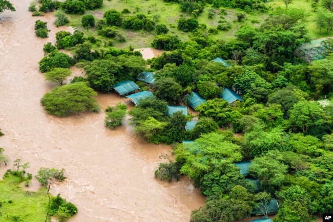 FILE - A lodge is visible in the flooded Maasai Mara National Reserve, which left dozens of tourists stranded in Narok County, Kenya, May 1, 2024. (AP Photo/Bobby Neptune, File)