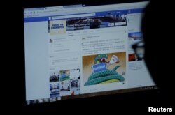 FILE - An internet user browses through the Vietnamese government's new Facebook page in Hanoi, Vietnam December 30, 2015. REUTERS/Kham/File Photo