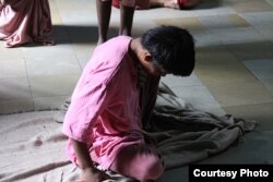 A resident sits on the floor of a mental hospital in the suburbs of Mumbai, India. (PHOTO/2013 Shantha Rau Barriga/Human Rights Watch)
