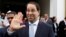 FILE - Tunisia's Prime Minister Youssef Chahed gestures after a meeting of the Islamic Development Bank Group in Tunis, Tunisia, April 4, 2018.