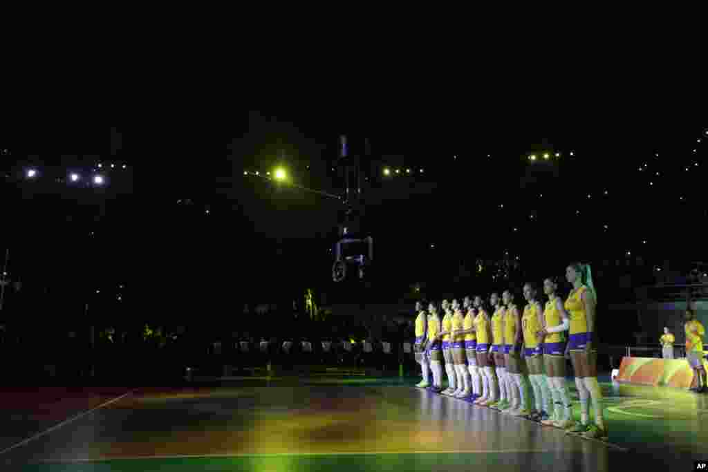 Members of team Brazil are introduced before the start of a women's preliminary volleyball match against Japan at the 2016 Summer Olympics in Rio de Janeiro, Brazil, Wednesday, Aug. 10, 2016. 