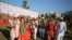 Brides and grooms arrive to take their wedding vows during a mass marriage ceremony, in which 261 including six Muslim and three Christian couples took their wedding vows, in Surat, Gujarat, India.