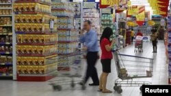 People shop at a Hypermart store in Jakarta. 