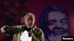 FILE - Former Brazilian President Luiz Inacio Lula da Silva gestures as he attends a meeting with women activists in Santo Andre, Brazil, Aug. 15, 2016.