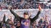 Denny Hamlin celebrates in Victory Lane after winning the NASCAR Daytona 500 Sprint Cup Series auto race at Daytona International Speedway in Daytona Beach, Florida, Sunday, Feb. 21, 2016.