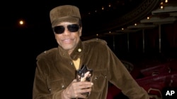 U.S singer/songwriter Bobby Womack poses for photographs after he is presented with the 'Bluesfest Lifetime Achievement Award' for Services To Soul', at the Royal Albert Hall in west London, Monday, Oct. 28, 2013