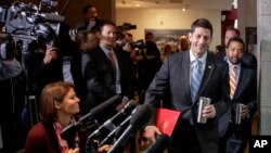 FILE - House Speaker Paul Ryan of Wisconsin walks past reporters on Capitol Hill in Washington, March 21, 2017, to meet with President Donald Trump who came to the Capitol to rally support for the Republican health care overhaul by taking his case directly to GOP lawmakers.