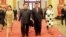 North Korean leader Kim Jong Un and wife Ri Sol Ju, and Chinese President Xi Jinping and wife Peng Liyuan walk together in Beijing, China, in this undated photo released by North Korea's Korean Central News Agency (KCNA) in Pyongyang March 28, 2018.