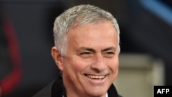 (FILES) In this file photo taken on November 11, 2018 Manchester United's Portuguese manager Jose Mourinho smiles before the English Premier League football match between Manchester City and Manchester United at the Etihad Stadium in Manchester, north wes