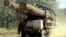 A truck carries logs on a rural road is seen in this July, 2002 photo taken in Preah Vihear province some 245 kilometers (152 miles) north of Phnom Penh, file photo. 