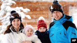 Britain's Prince William, right, and Duchess of Cambridge with their children, Princess Charlotte, center left, and Prince George, enjoy a short private break skiing in the French Alps, March 3, 2016. 